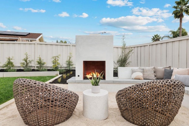 view of patio / terrace with exterior fireplace