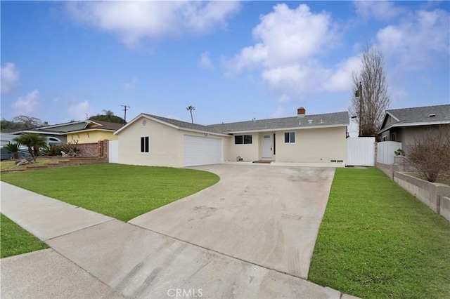 ranch-style home featuring a garage and a front lawn