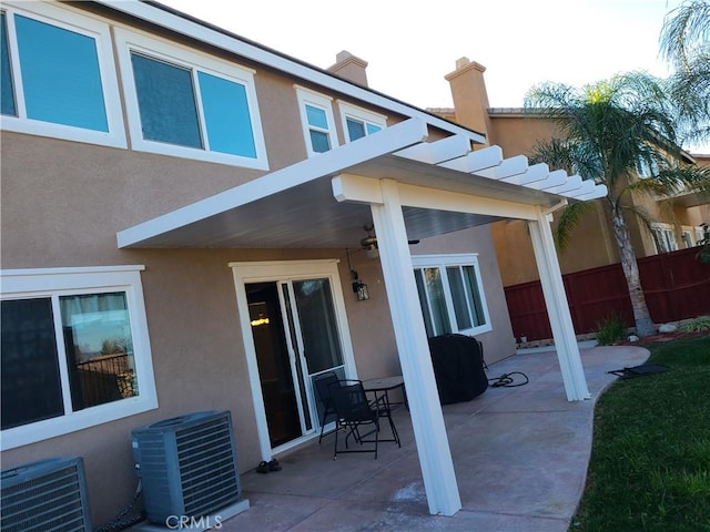 back of property featuring central AC unit and a patio area