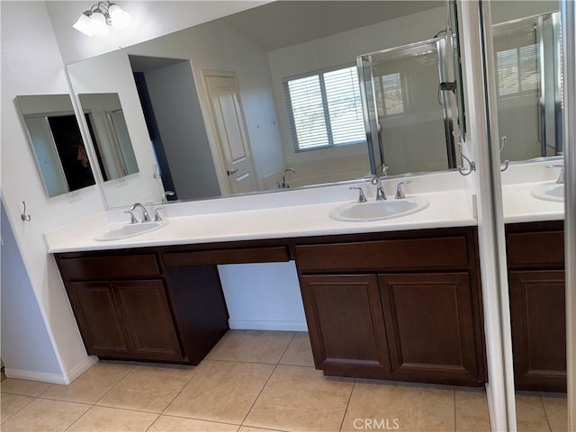 bathroom with tile patterned flooring, vanity, and an enclosed shower