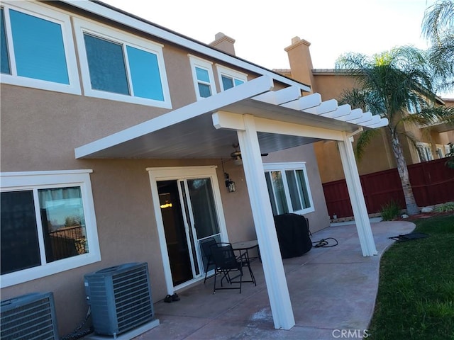 back of house featuring a pergola, central AC, and a patio area