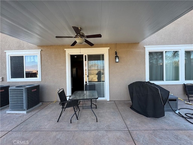 view of patio featuring area for grilling, central AC, and ceiling fan