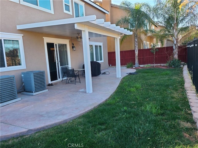 view of yard featuring central AC and a patio area