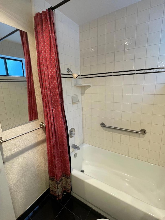 bathroom with shower / tub combo and tile patterned floors