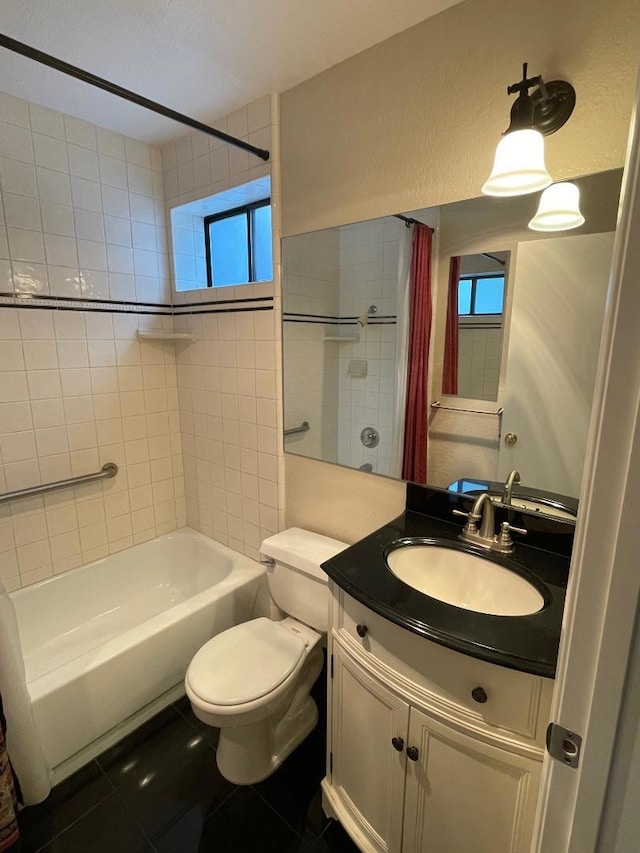 full bathroom featuring tile patterned flooring, vanity, shower / bath combo, and toilet