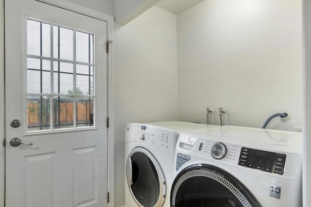 laundry room featuring washing machine and clothes dryer