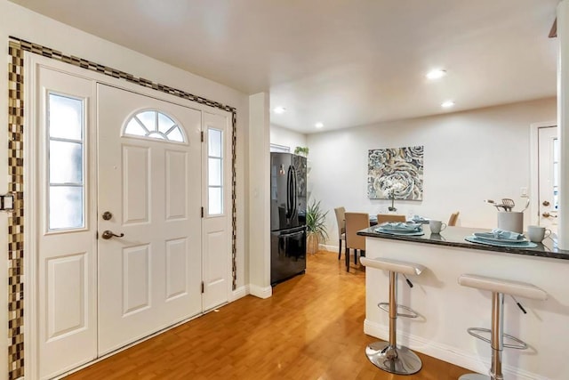 entryway with wood-type flooring