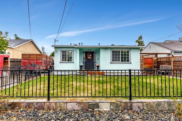 ranch-style house with a front lawn