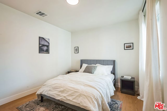 bedroom featuring light wood-type flooring