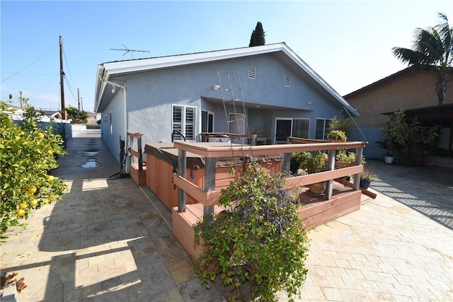 back of house with a patio area