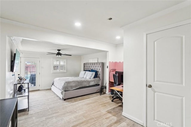 bedroom featuring access to exterior, light hardwood / wood-style flooring, ornamental molding, and ceiling fan