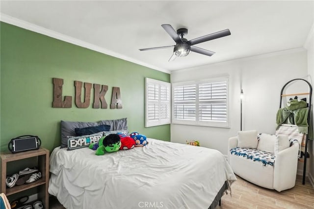 bedroom featuring crown molding and ceiling fan