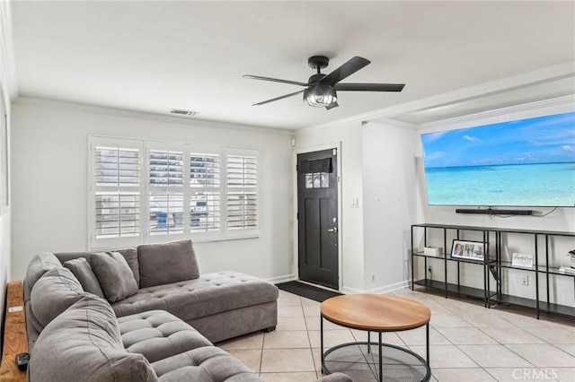 living room with ornamental molding, light tile patterned floors, and ceiling fan