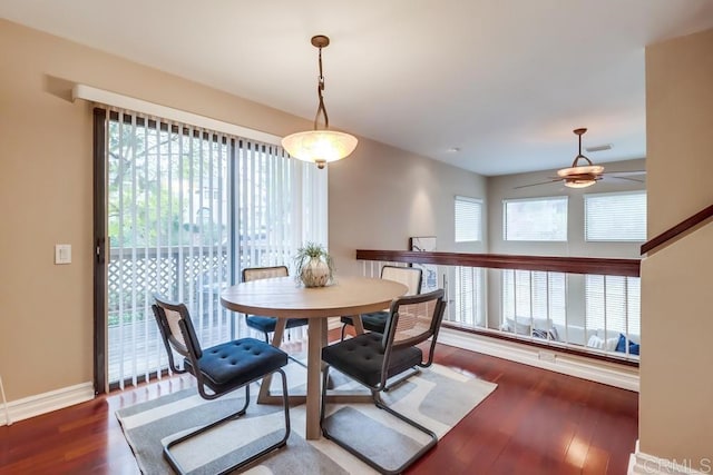 dining space with a healthy amount of sunlight, hardwood / wood-style floors, and ceiling fan