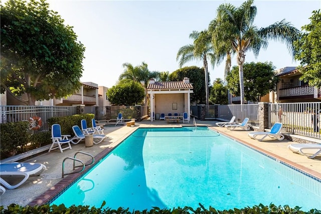 view of swimming pool with a patio