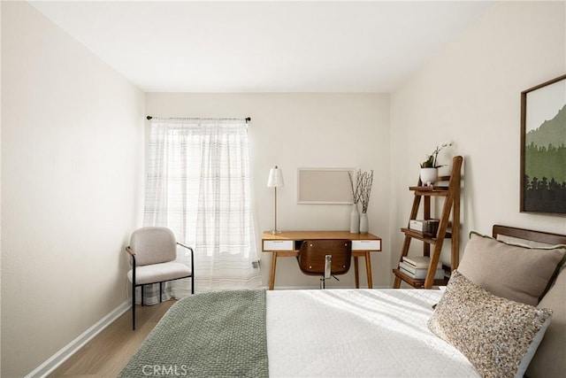 bedroom with wood-type flooring