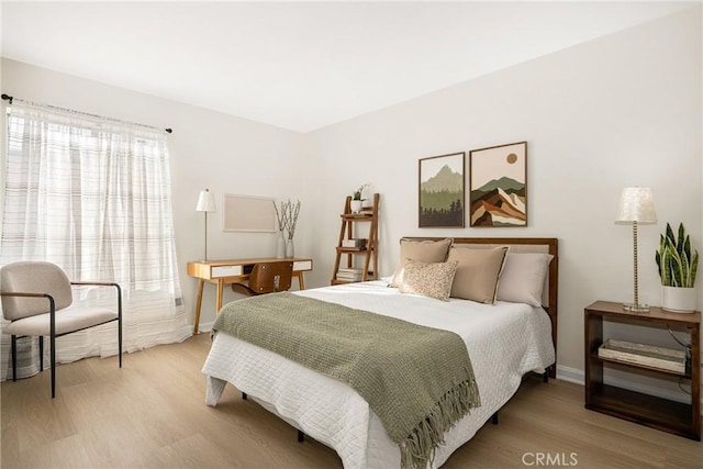 bedroom with wood-type flooring