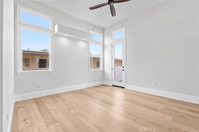 unfurnished room with ceiling fan and light hardwood / wood-style flooring