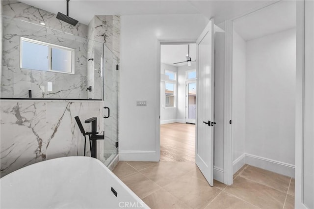 bathroom featuring shower with separate bathtub, tile patterned floors, and ceiling fan