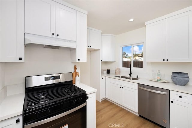 kitchen featuring white cabinetry, appliances with stainless steel finishes, and sink