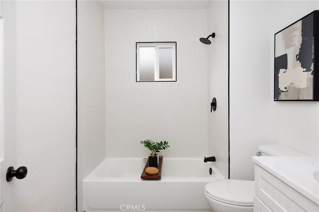 full bathroom featuring vanity, toilet, and tiled shower / bath