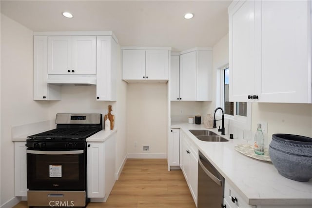 kitchen featuring white cabinetry, appliances with stainless steel finishes, and sink