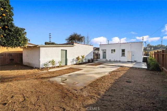 back of house featuring a patio