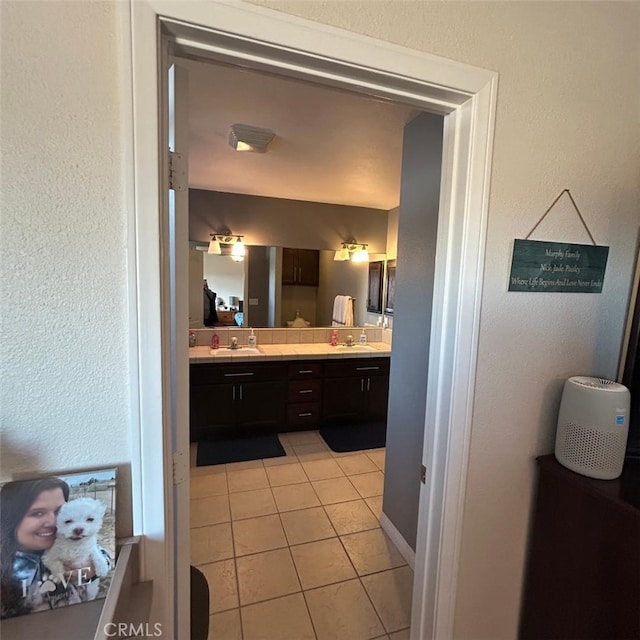 bathroom with tile patterned floors and vanity