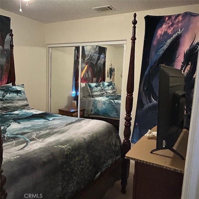 bedroom featuring a closet and a textured ceiling