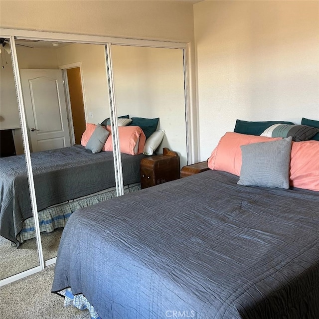 carpeted bedroom with a closet