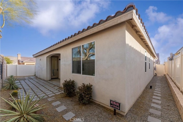 back of property featuring a patio area