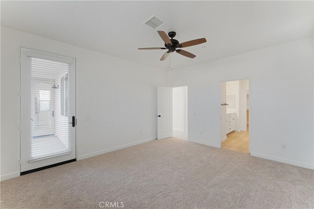 empty room featuring light colored carpet and ceiling fan