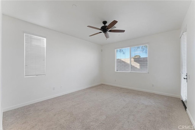 unfurnished room featuring ceiling fan and light colored carpet