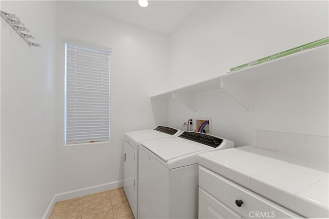 washroom featuring light tile patterned flooring and independent washer and dryer