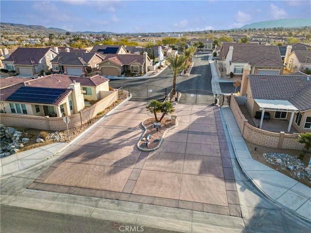 birds eye view of property with a mountain view