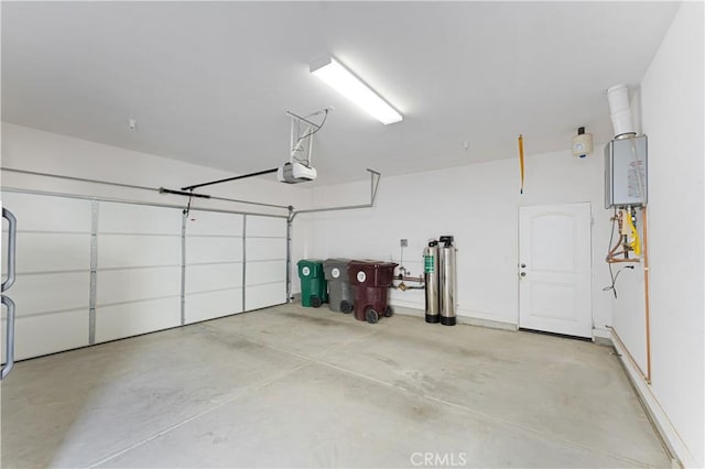 garage with a garage door opener and water heater