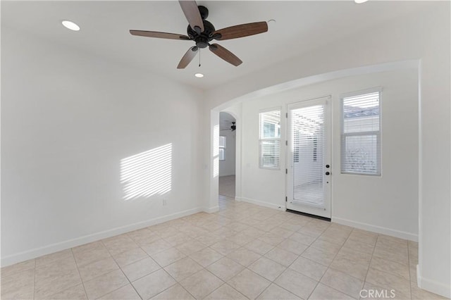 entryway with ceiling fan and light tile patterned floors