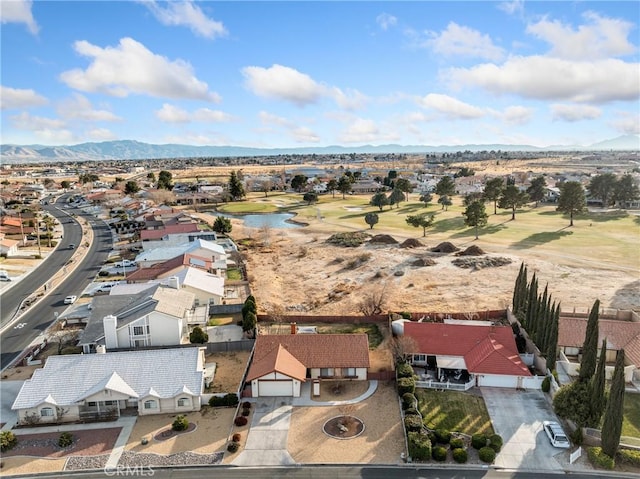 birds eye view of property with a mountain view