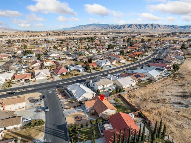 birds eye view of property with a mountain view