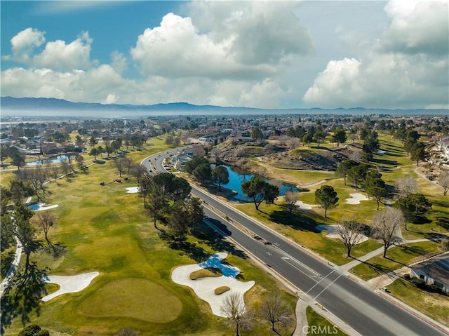 drone / aerial view featuring a water and mountain view