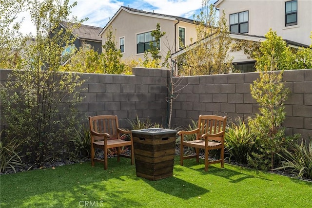 view of yard with an outdoor fire pit