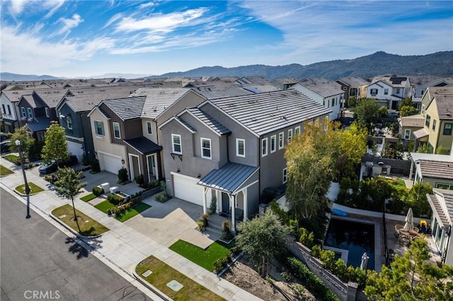 drone / aerial view featuring a mountain view