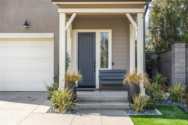 doorway to property with a garage