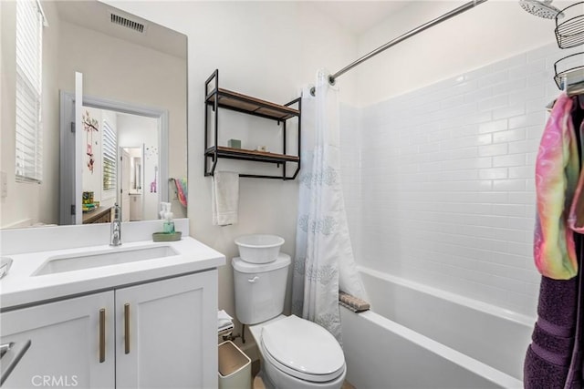 full bathroom featuring vanity, toilet, and shower / bath combo with shower curtain