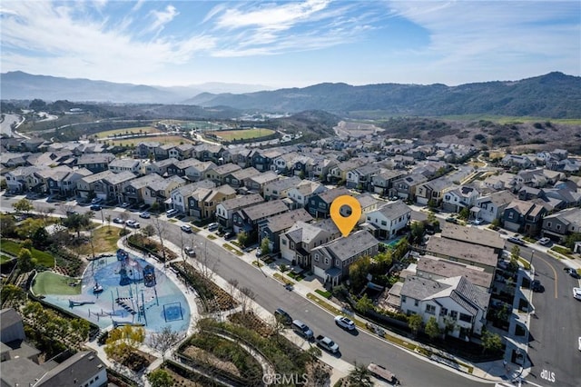 birds eye view of property featuring a mountain view