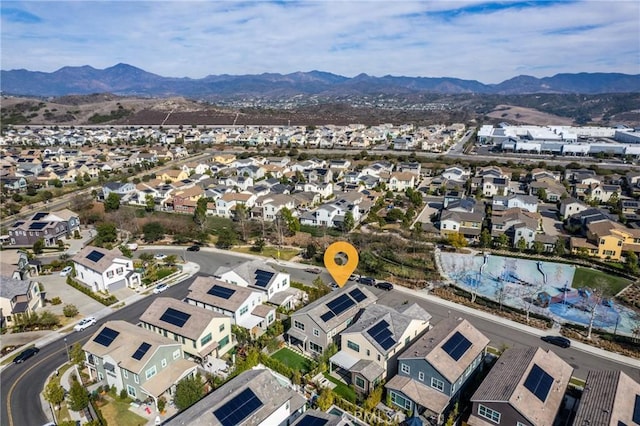 birds eye view of property featuring a mountain view