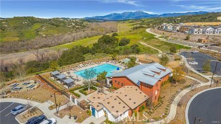 drone / aerial view featuring a mountain view