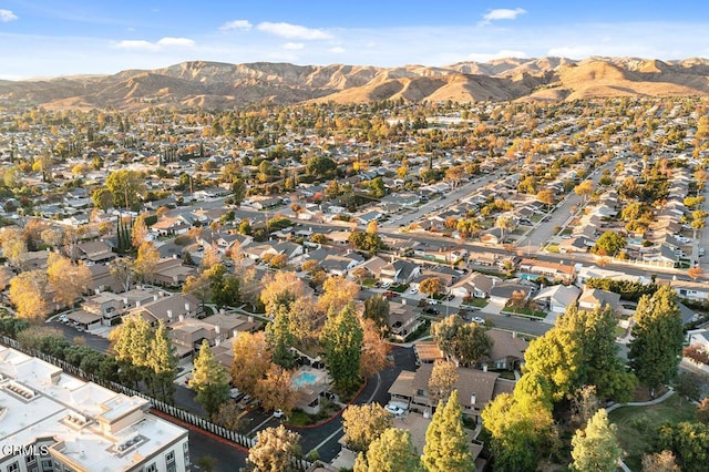 birds eye view of property featuring a mountain view