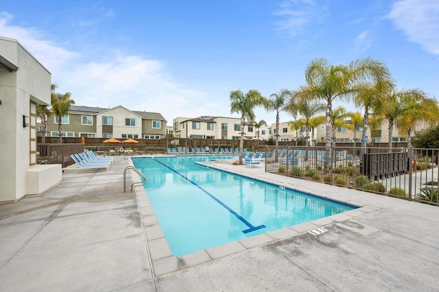 view of swimming pool with a patio area