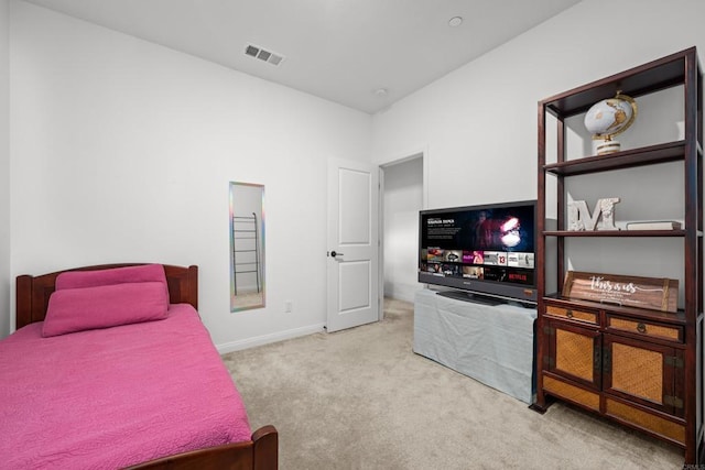 bedroom with light carpet